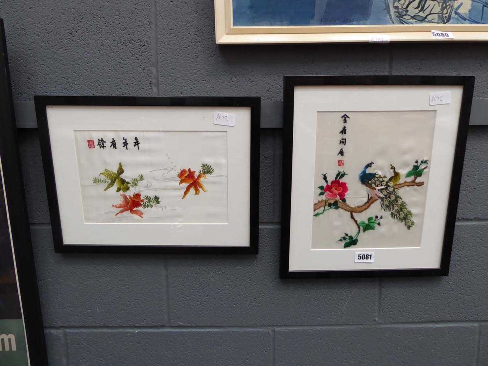 Two embroidered silk pictures, goldfish and peacocks