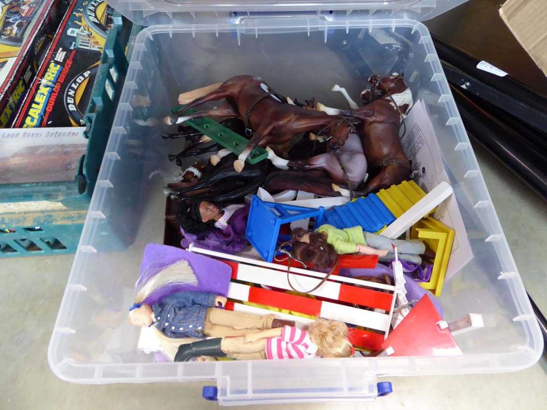 Box of horse figurines and dolls