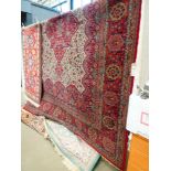 (2) 3.5 x 2.5m red floral carpet with red central medallion