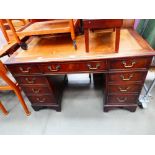 Twin pedestal desk with tan leather surface