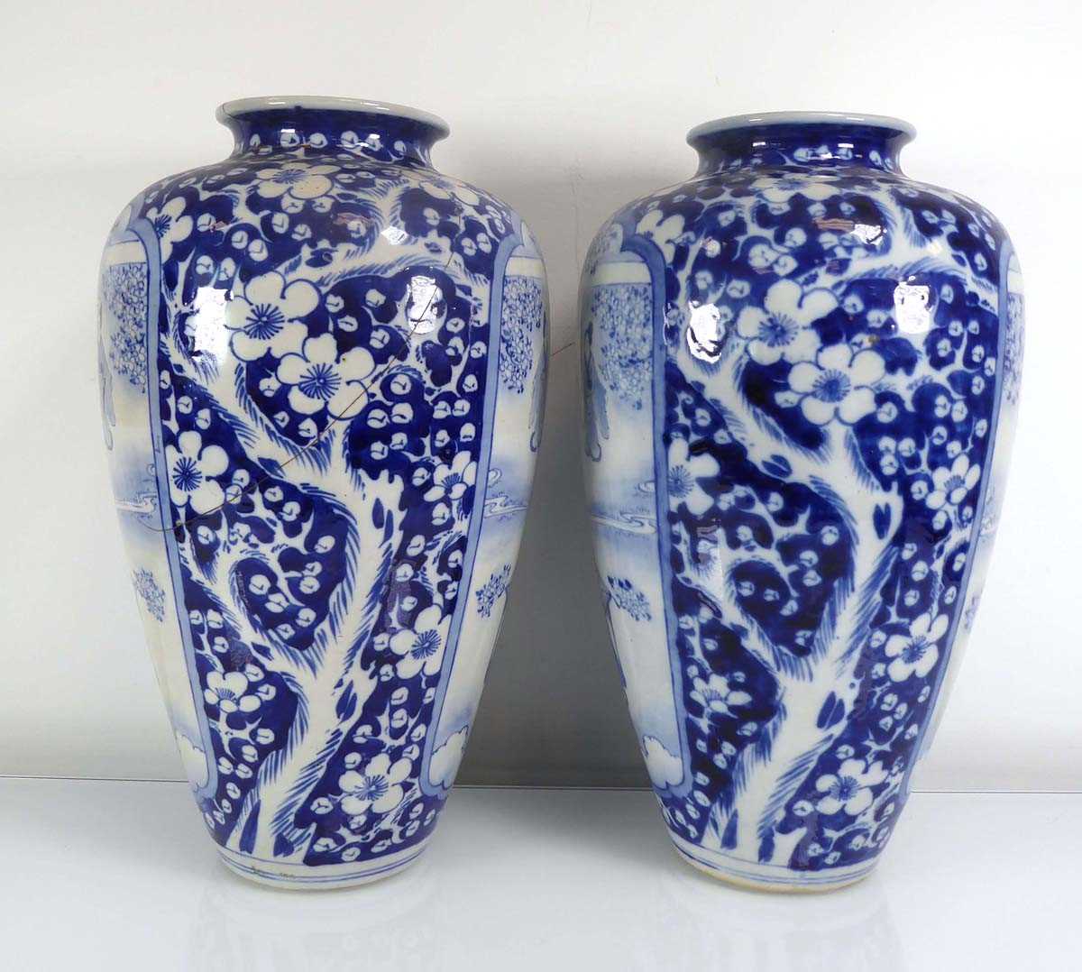 A pair of Chinese blue and white shouldered vases, each decorated with traditional figures at - Image 4 of 5