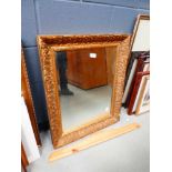 Rectangular bevelled mirror in gilt floral frame