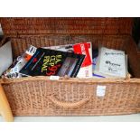 Box containing Olympic badges, vintage games, programmes and sheet music