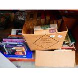 Three boxes containing cookery books, reference books and a quantity of novels