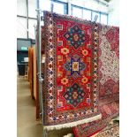 (3) Multi coloured Iranian mat with floral and geometric pattern