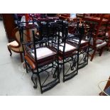 Six wrought iron dining chairs