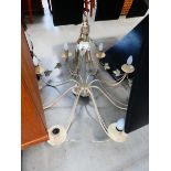 Cream painted metal eight branch ceiling light