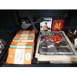 Cage containing vintage fan, DVD box sets, Princess Diana ephemera and Penguin novels