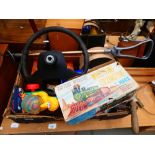 Box containing shooting stick, rose sprayer, steering wheel, toys and games
