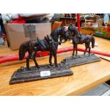 Pair of horse shaped cast iron door stops