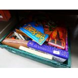 Box containing a quantity of travel guides, scouting books, and classic novels