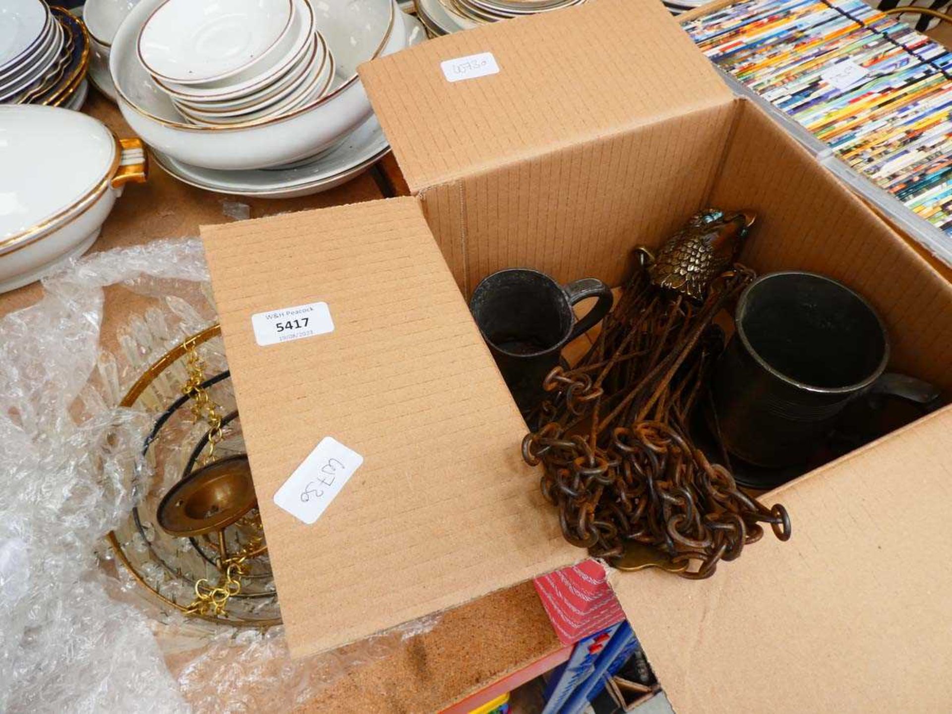 Box containing two pewter mugs. Plus wirework measure and brass eagles head and 4 tier chandelier