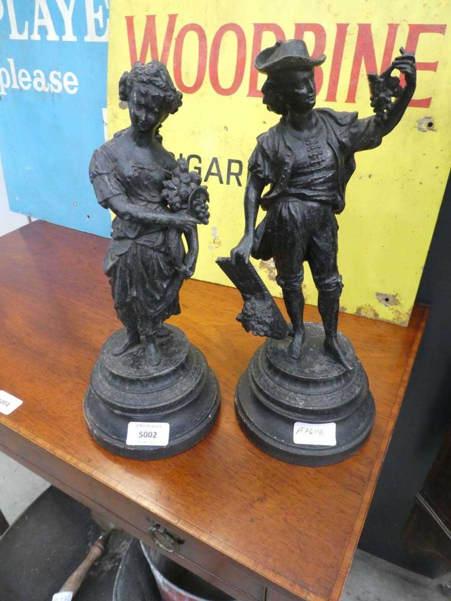 Pair of Spelter figures- farm labourer and fruit seller