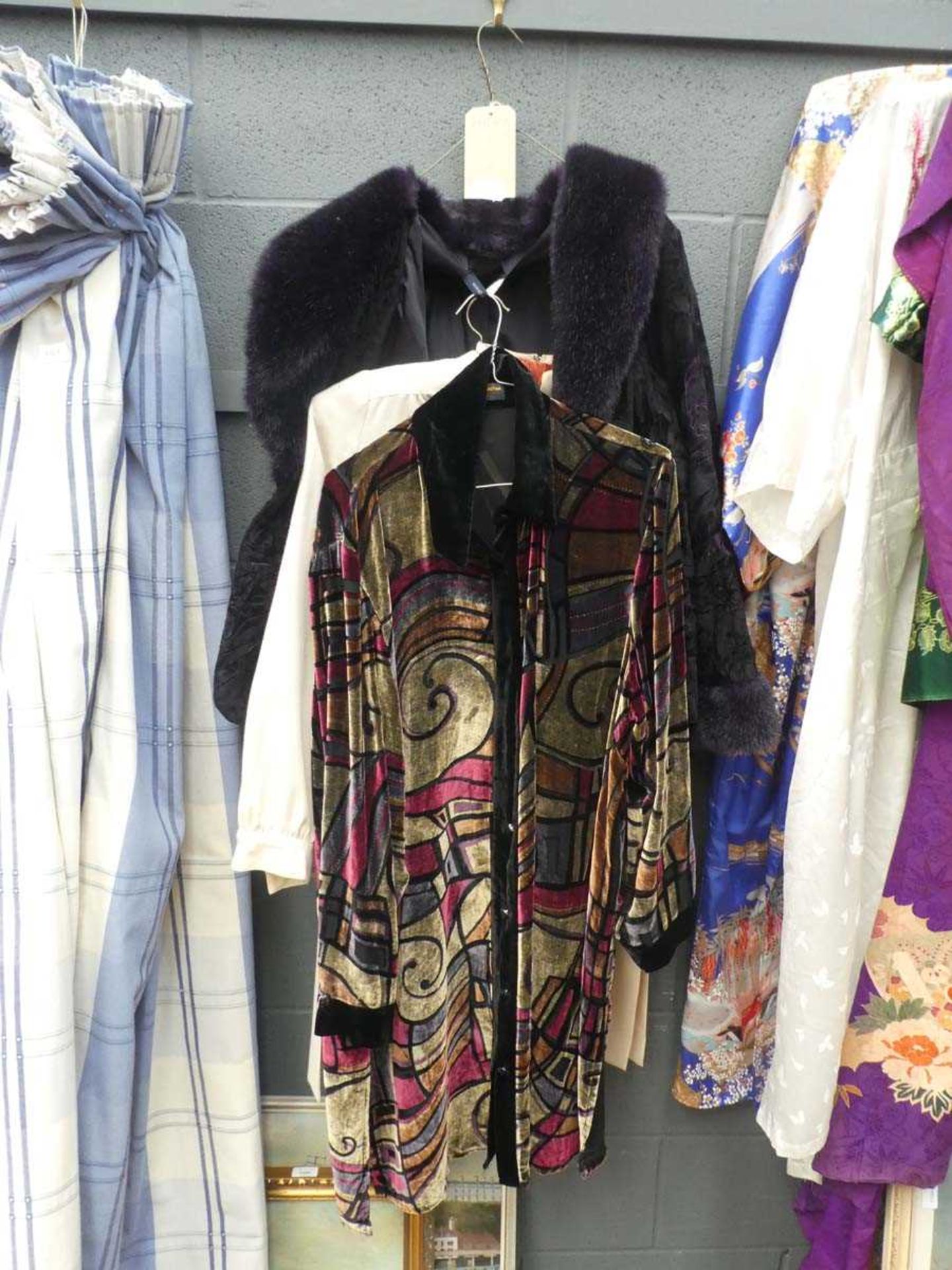 Three multicoloured ladies coats and dresses