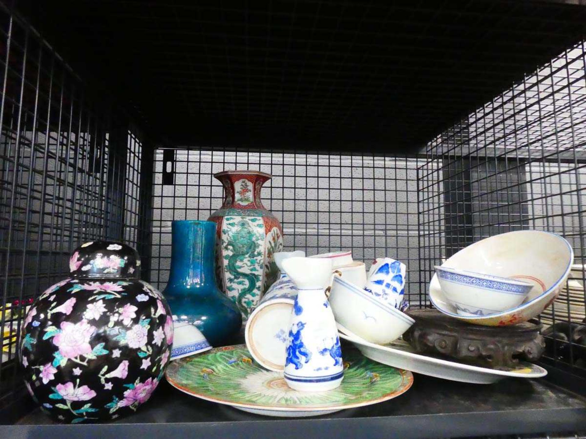 Cage containing ginger jar, dragon patterned vase, and blue and white Chinese ceramics