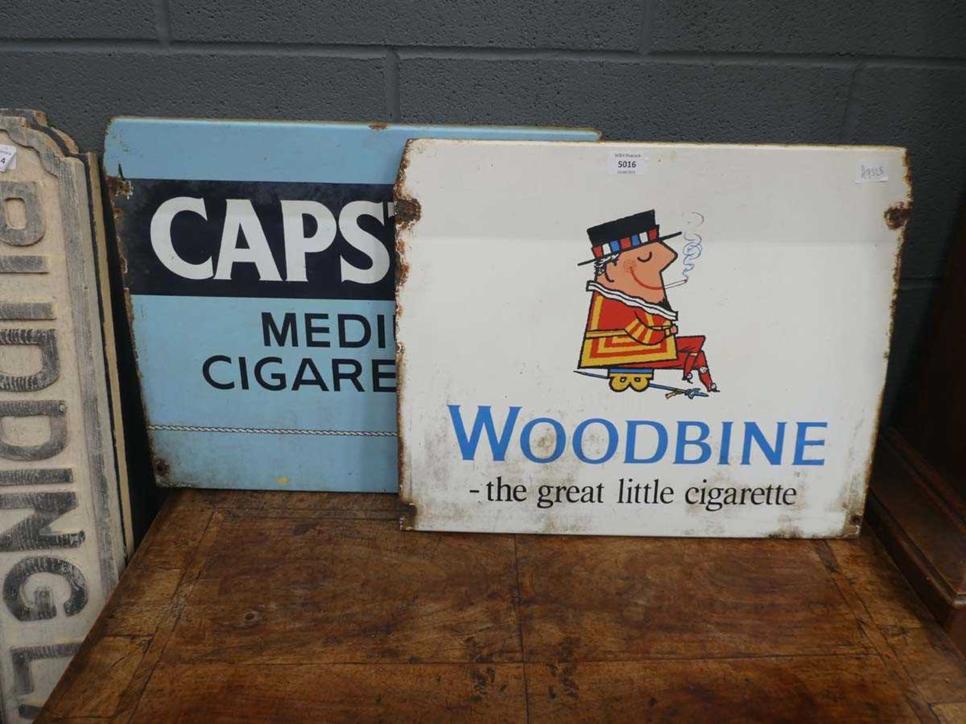 2 enamelled Capstan and Woodbine cigarette signs