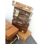 Stack of 7 vintage leather and leather finish cases, max width: 59cm