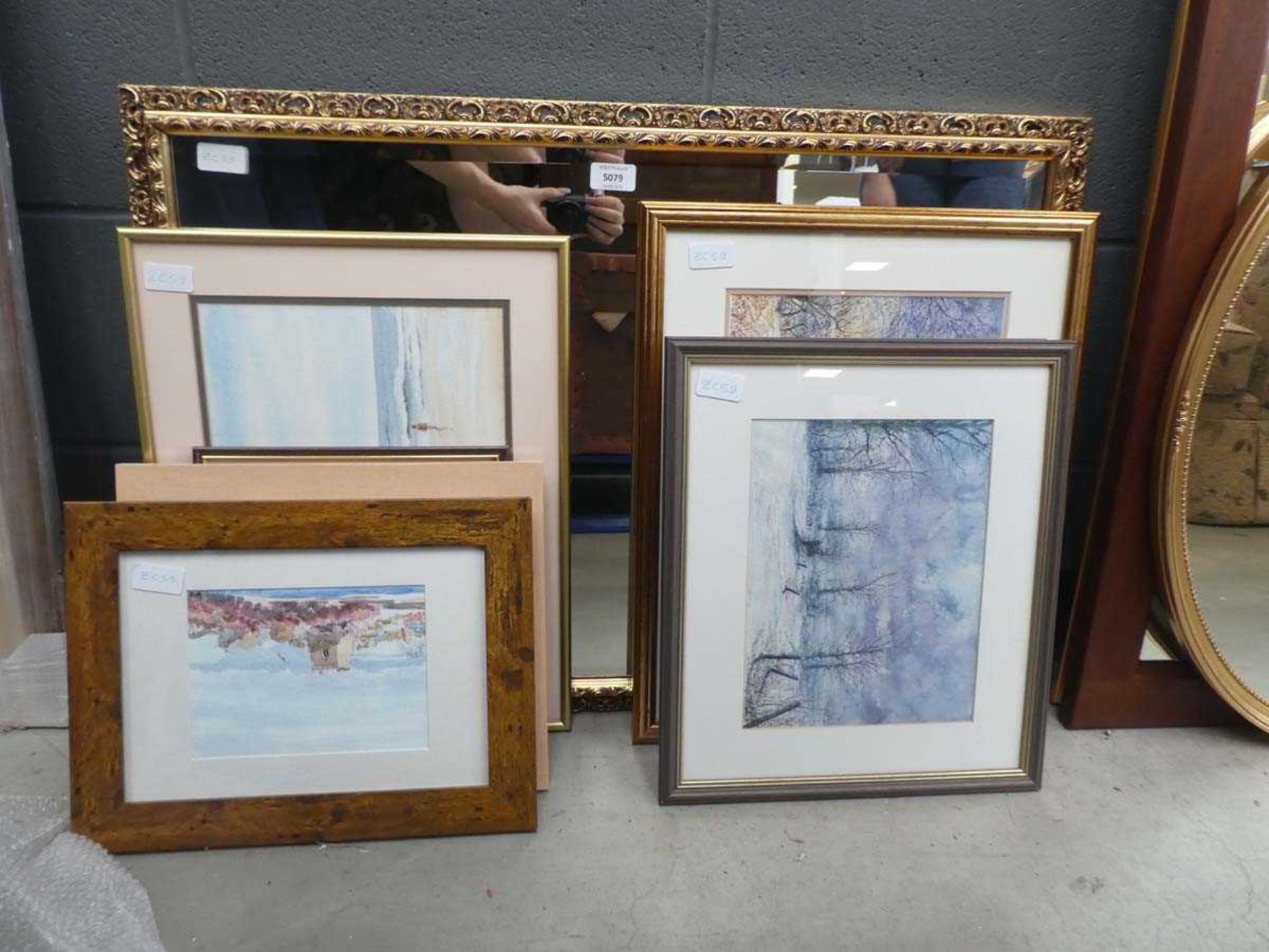 Stack of watercolours and prints together with gilt framed mirror