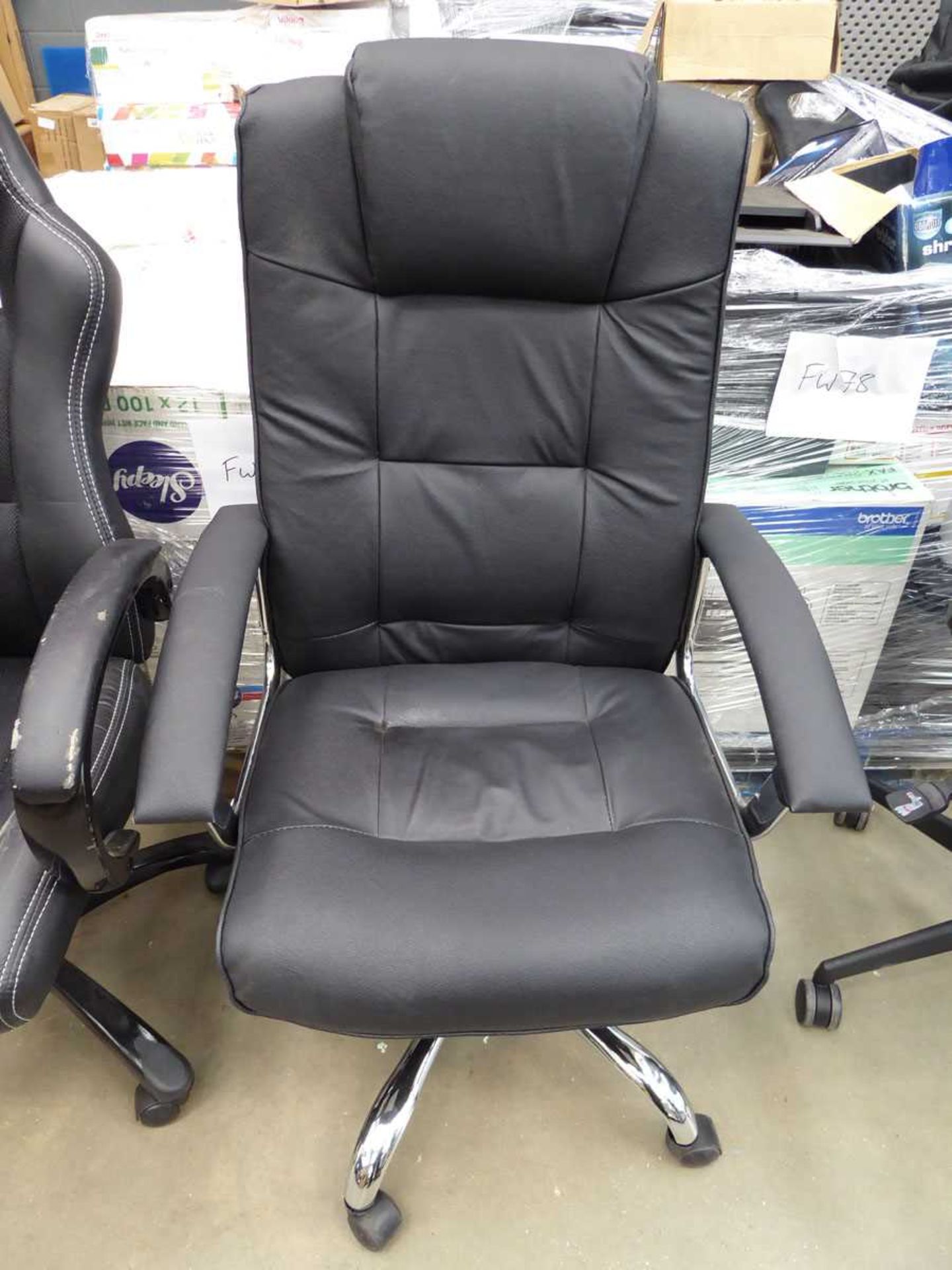 Black chrome based swivel armchair