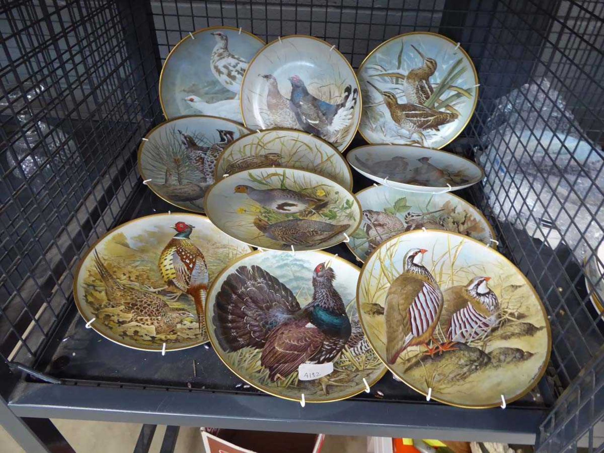 Cage containing gamebird patterned collectors plates