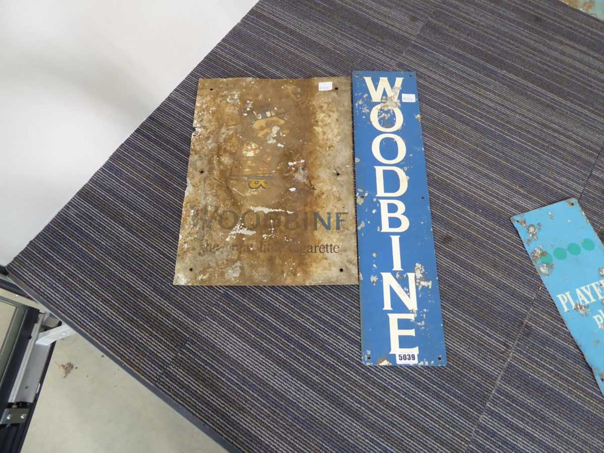 Two Woodbine cigarette tin signs