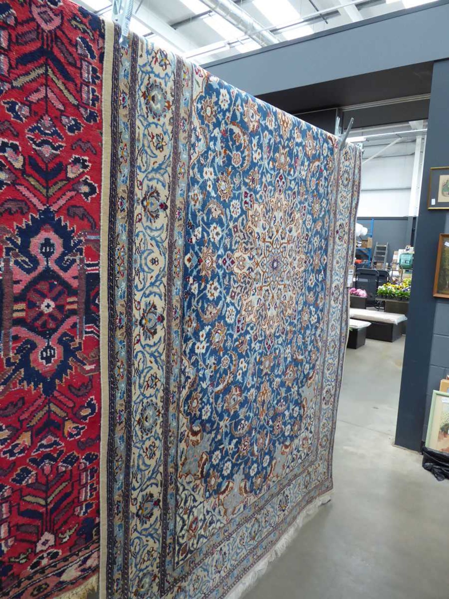 (3) Woollen Indian carpet with floral pattern and central medallion