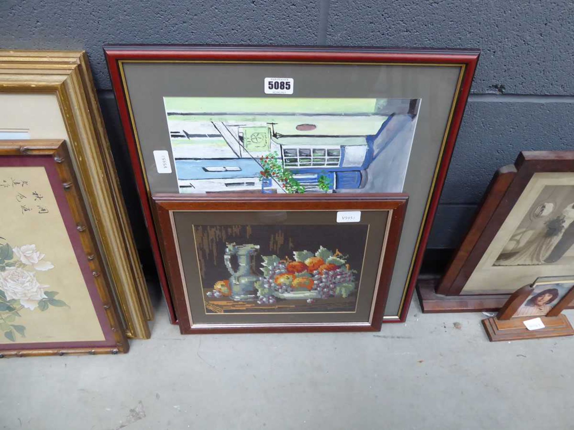 Picture of a townscape, another of thatched cottage and an embroidery