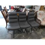 Set of 3 modern grey leatherette upholstered dining chairs on black metal 5 star supports