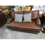 Brown leather 2 seater sofa on castors