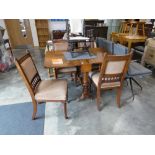 Mahogany and walnut drop leaf dining table with 4 mahogany framed beige upholstered dining chairs