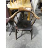 Captains type dark oak spindle back armchair