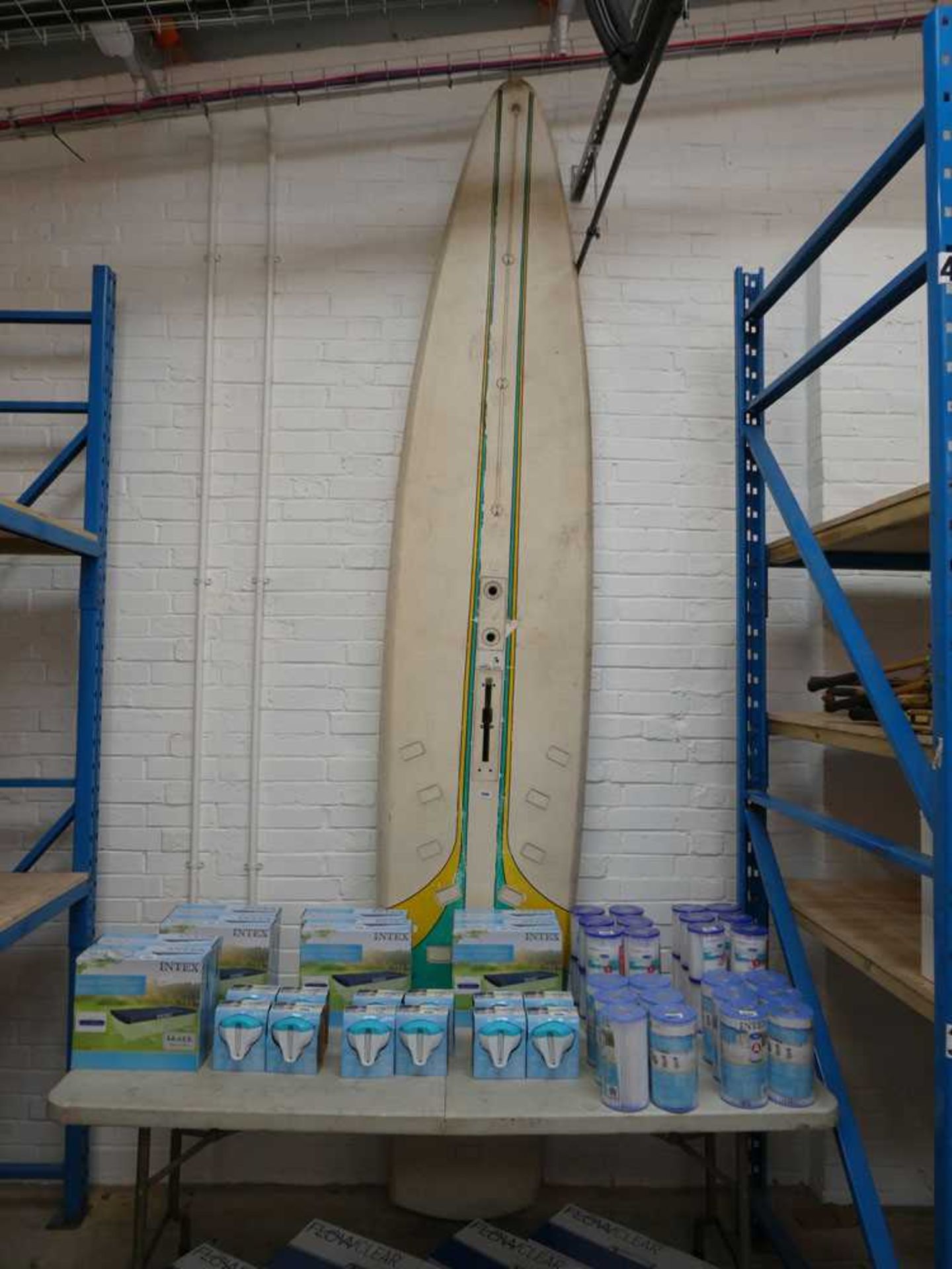 Large green, yellow and cream coloured paddle board