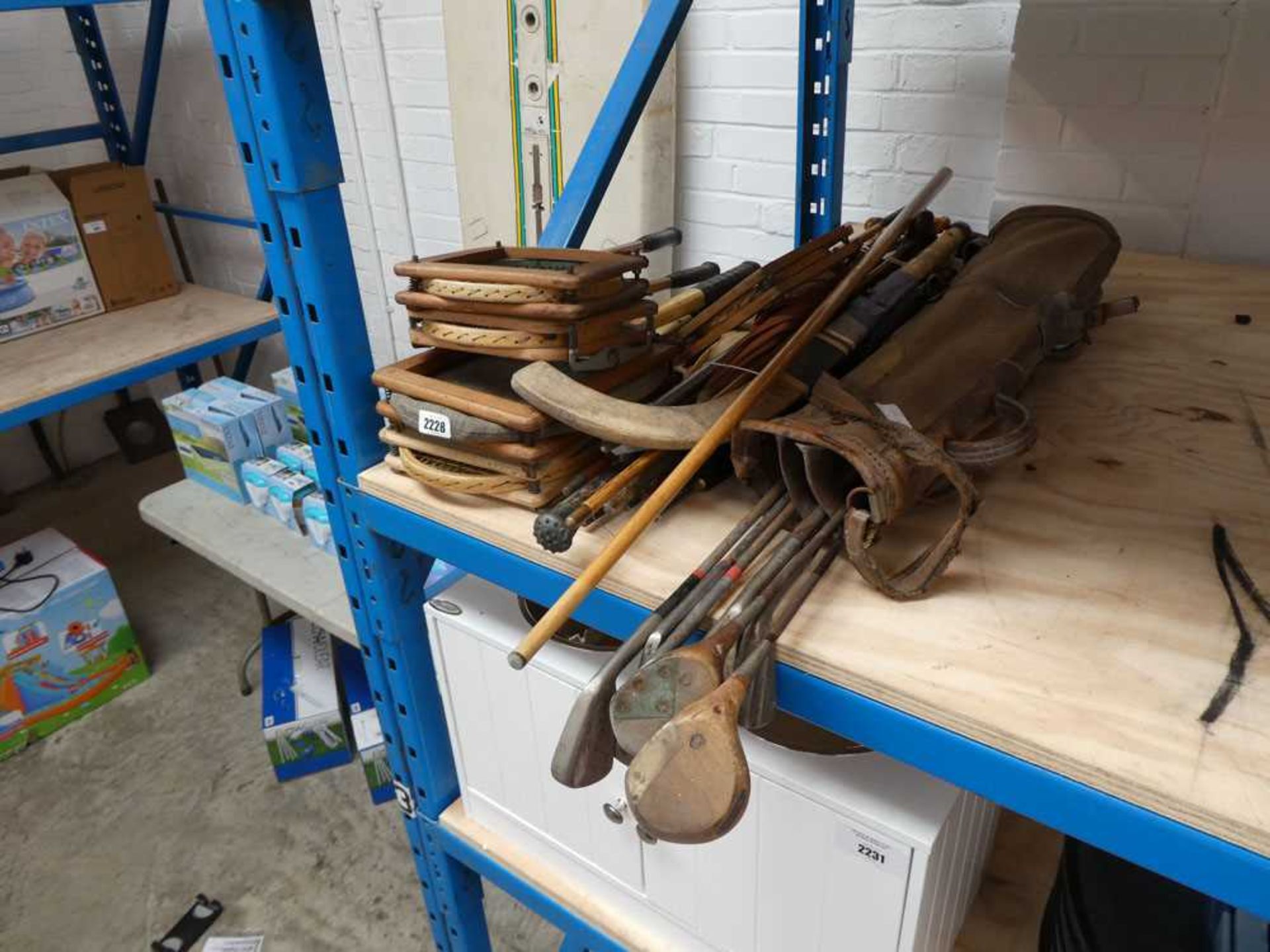 Large quantity of vintage outdoor tennis and badminton rackets, vintage golf clubs and walking