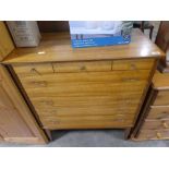 Mid-century teak chest of drawers with delicate brass handles