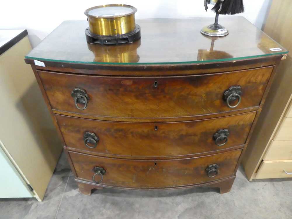 Mahogany bow fronted chest of 3 drawers with glass surface
