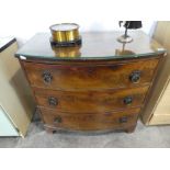 Mahogany bow fronted chest of 3 drawers with glass surface