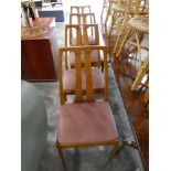 Set of 4 teak framed dining chairs with pink upholstered seats