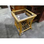 Small glass topped bamboo framed coffee table