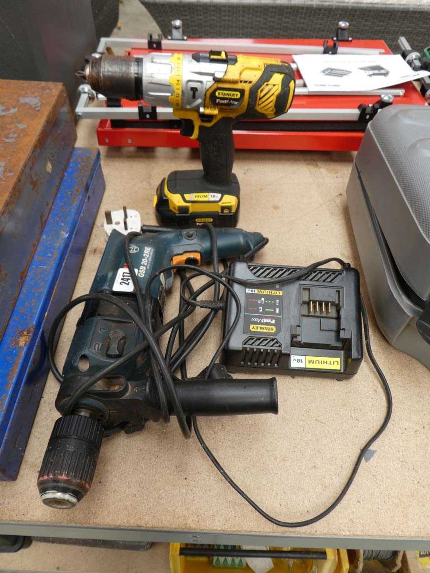 Stanley FatMax drill with batter and charger; together with a Bosch hammer drill