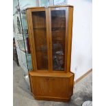 Mid century teak corner cabinet with glazed doors