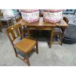 Oak drop leaf dining table with 5 padded chairs