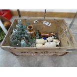 Vintage wooden box with ceramic and glass bottles
