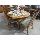 Mid century design extending dining table plus 4 chairs with upholstered seats, in the style of