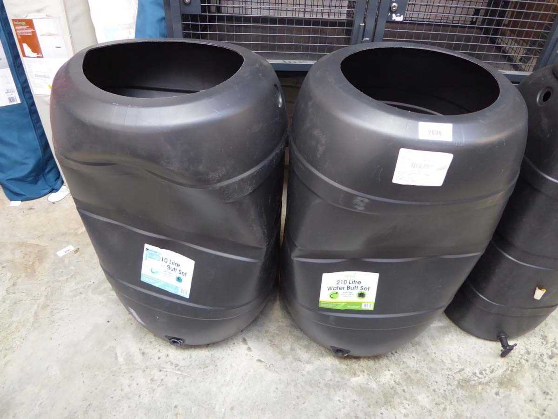 +VAT Pair of Ward 210L water butts (both dented on front)