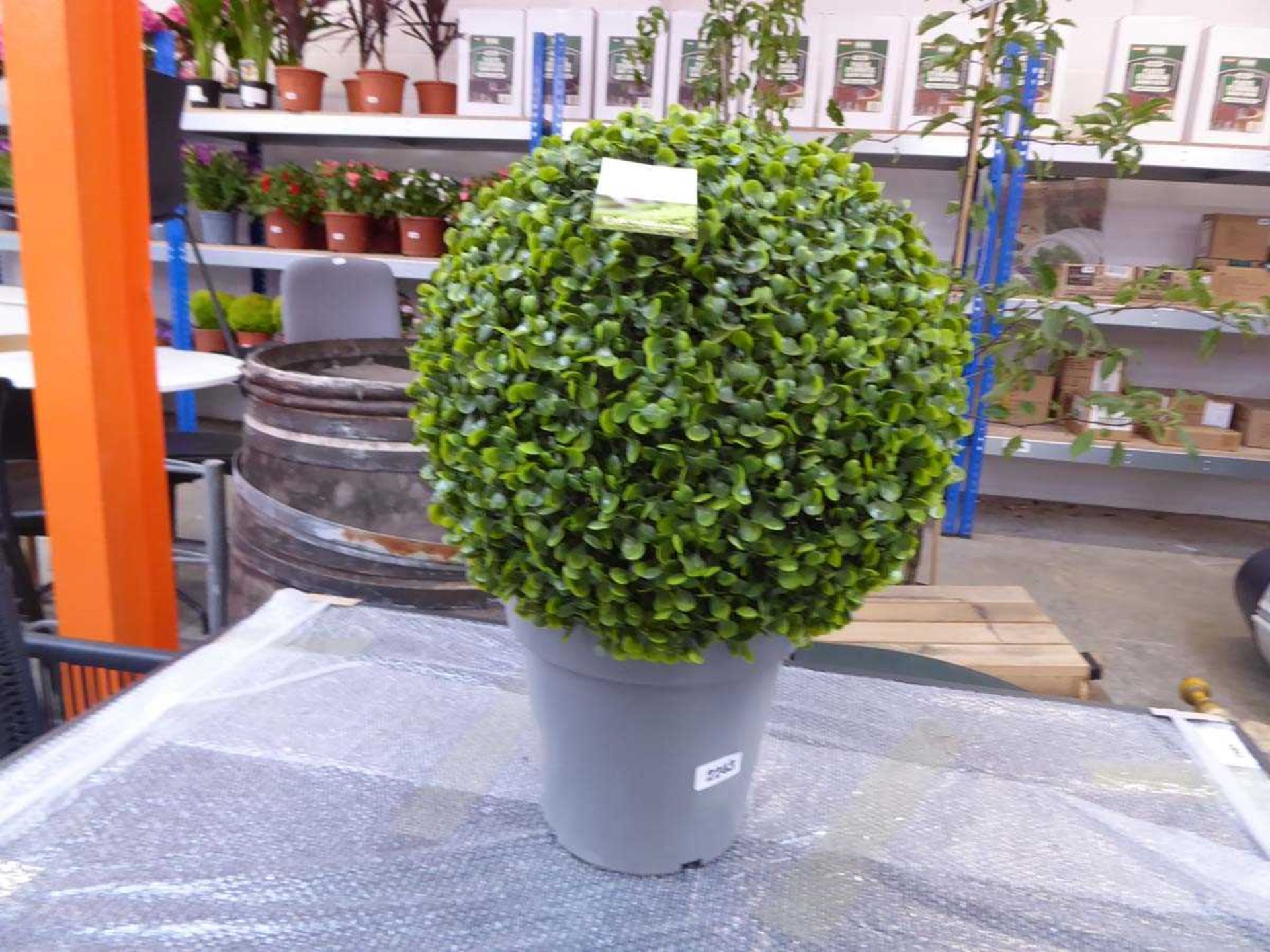 Potted artificial ball shrub