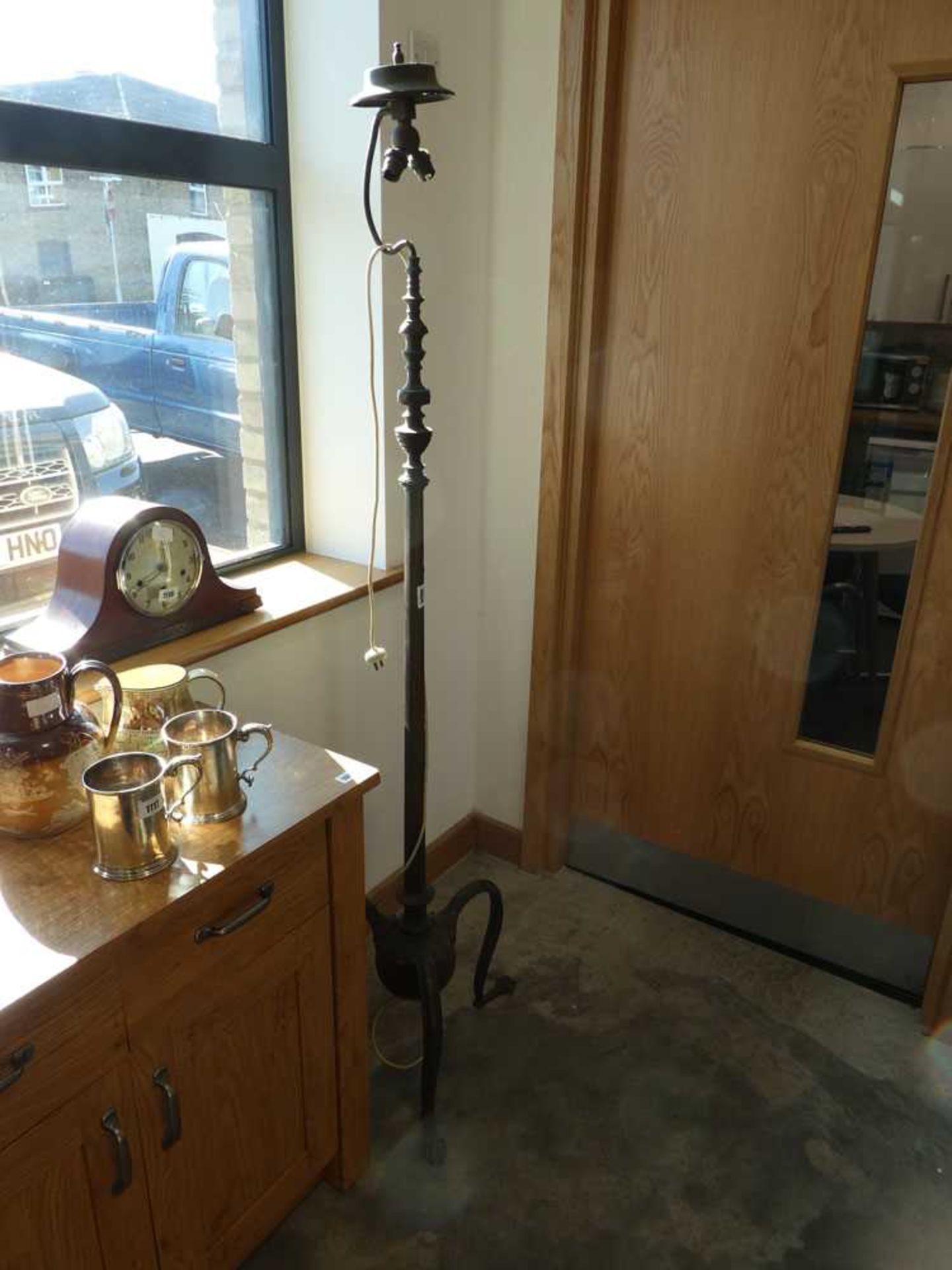 Twin branch brass standard floor lamp on 3 curved claw shaped supports