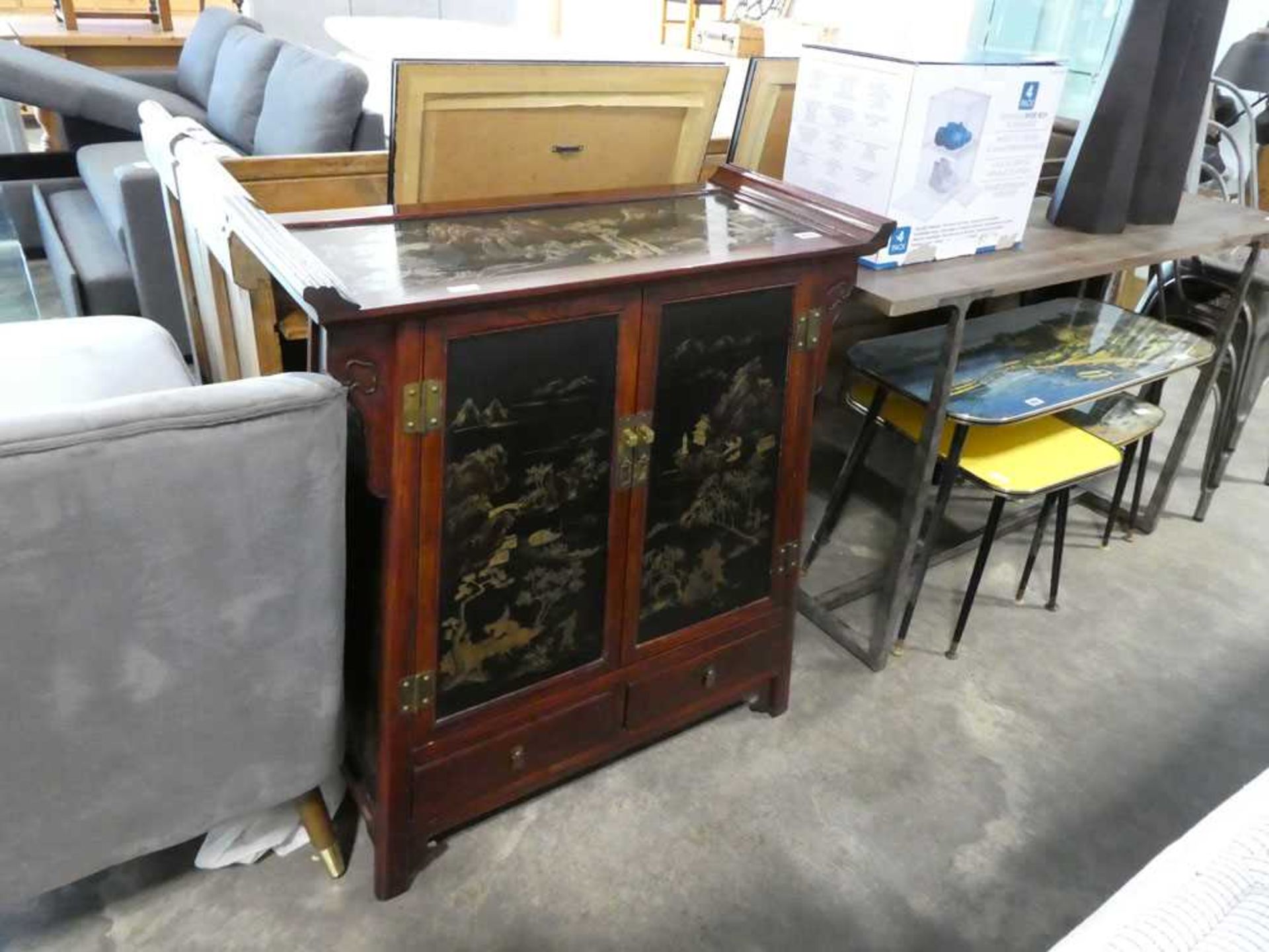 Oriental hard wood cabinet with decorative inset gilt painted panels depicting traditional scenes