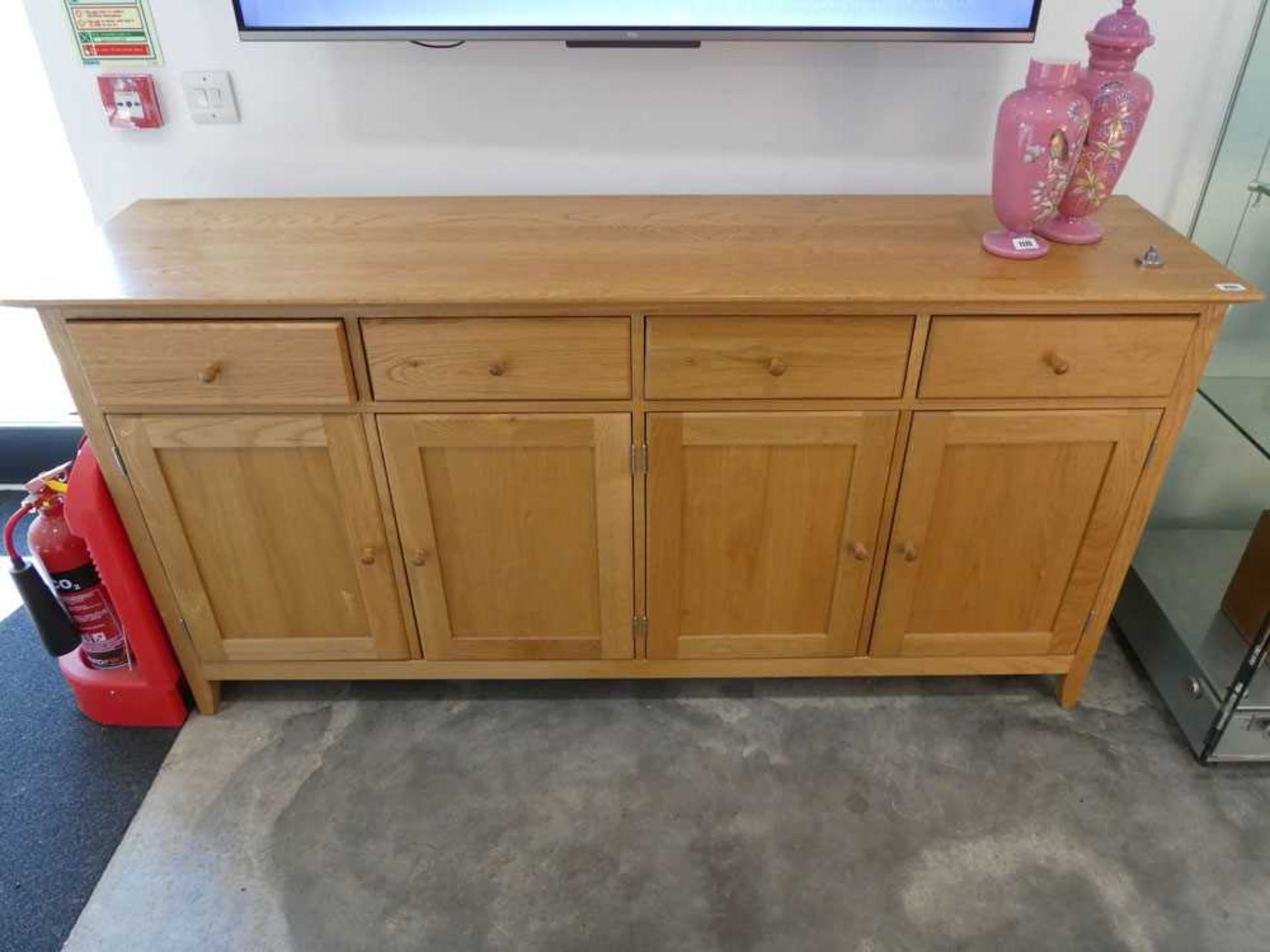 Modern light oak sideboard with 4 cupboards and 4 drawers