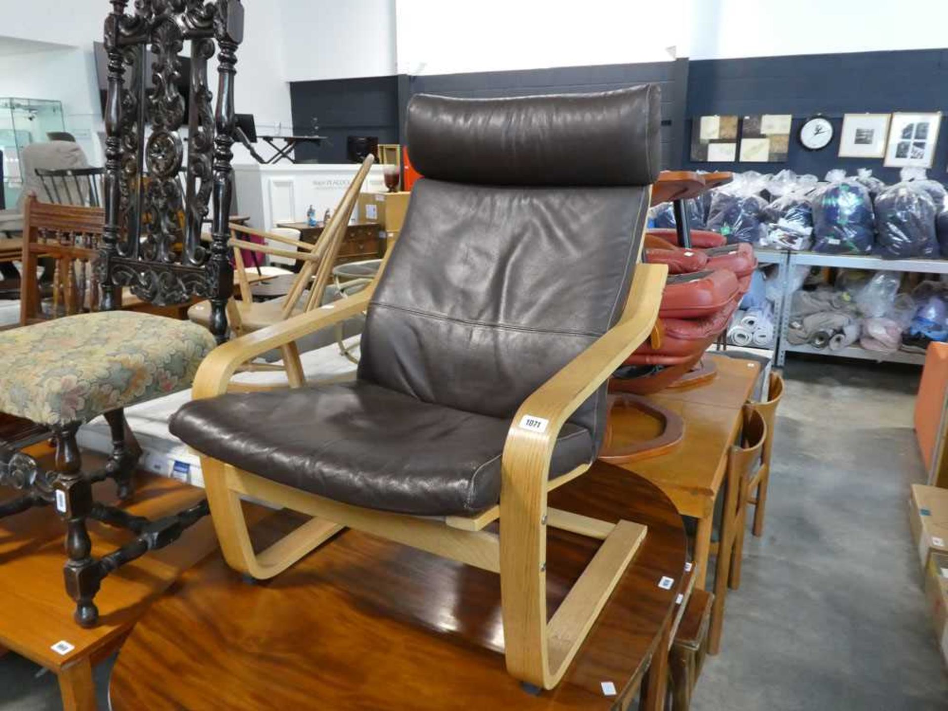 Brown leatherette upholstered easy chair on oak effect bentwood frame