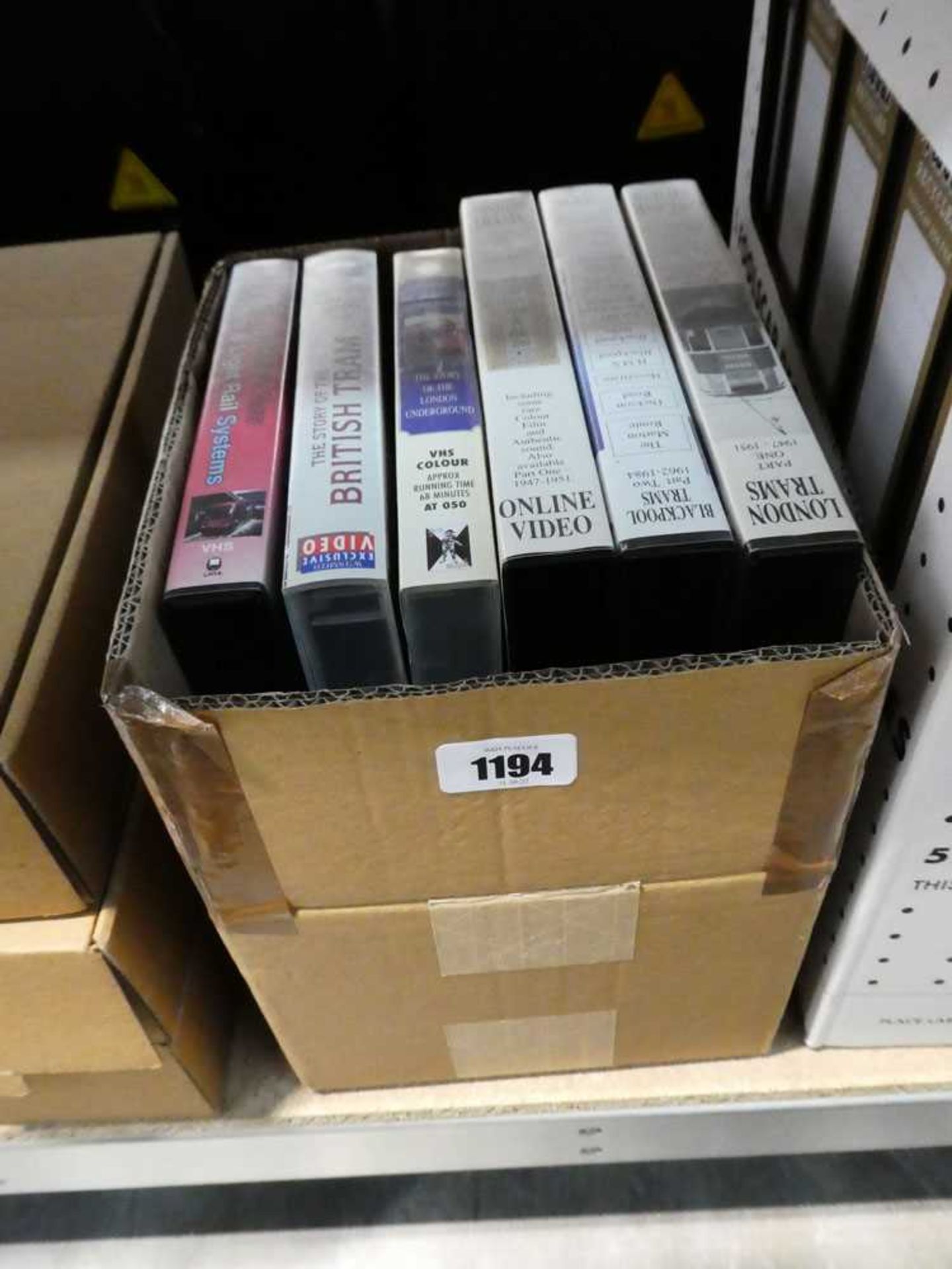 Small box of VHS tapes on the theme of steam locomotives and trams